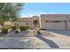 Single-story home with a two-car garage and well-manicured landscaping at 4331 E Cortez St, Phoenix, AZ 85028