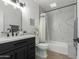 Clean bathroom with marble shower and dark vanity at 4830 N 65Th St, Scottsdale, AZ 85251