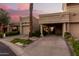 Tan stucco exterior, two-car garage, and lush landscaping at 4830 N 65Th St, Scottsdale, AZ 85251