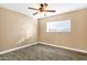 Bright bedroom with wood-look floors and ceiling fan at 5704 W Hearn Rd, Glendale, AZ 85306