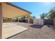 Covered patio and storage shed in a gravel backyard at 7275 W Tina Ln, Glendale, AZ 85310