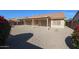 Spacious backyard with covered patio and gravel landscaping at 7275 W Tina Ln, Glendale, AZ 85310