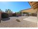 Landscaped backyard with covered patio and storage shed at 7275 W Tina Ln, Glendale, AZ 85310