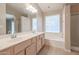 Bathroom with double vanity and bathtub at 7275 W Tina Ln, Glendale, AZ 85310