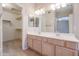 Bathroom with double vanity and walk in closet at 7275 W Tina Ln, Glendale, AZ 85310
