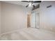 Spacious bedroom with mirrored closet and ceiling fan at 7275 W Tina Ln, Glendale, AZ 85310