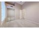 Bedroom with mirrored closet doors and access to bathroom at 7275 W Tina Ln, Glendale, AZ 85310