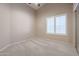 Bedroom with window shutters and carpeted floor at 7275 W Tina Ln, Glendale, AZ 85310