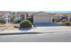 House exterior showcasing a two-car garage and front yard at 7275 W Tina Ln, Glendale, AZ 85310
