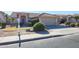 House exterior with a two-car garage and well-maintained landscaping at 7275 W Tina Ln, Glendale, AZ 85310