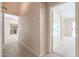 Hallway with tile flooring, offering views of the kitchen and living areas at 7275 W Tina Ln, Glendale, AZ 85310
