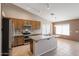 Modern kitchen with granite countertops and an island at 7275 W Tina Ln, Glendale, AZ 85310