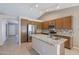 Modern kitchen with granite countertops and wooden cabinets at 7275 W Tina Ln, Glendale, AZ 85310