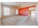 Living room with an accent wall and neutral carpeting at 7275 W Tina Ln, Glendale, AZ 85310