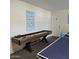 Shuffleboard table in a well-lit game room at 7300 N 51St Ave # E78, Glendale, AZ 85301