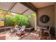 Covered patio with seating and dining areas at 7318 E Palo Verde Dr # 10, Scottsdale, AZ 85250