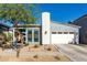 Single-story home with gray exterior, white garage door, and landscaping at 824 E Monte Way, Phoenix, AZ 85042