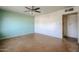 Spacious bedroom with light walls and ceiling fan at 1017 E Diana Ave, Phoenix, AZ 85020