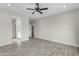 Main bedroom with ceiling fan and en-suite bathroom access at 10298 W Devonshire Dr, Arizona City, AZ 85123