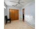 Bedroom with double doors to closet and ceiling fan at 1161 S Grand Dr, Apache Junction, AZ 85120