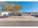 Ranch style home with a well-manicured lawn and driveway at 1161 S Grand Dr, Apache Junction, AZ 85120