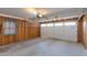 Unfinished garage with overhead door and ample storage space at 1161 S Grand Dr, Apache Junction, AZ 85120
