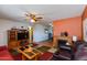 Open living area with a fireplace and wood entertainment center at 1161 S Grand Dr, Apache Junction, AZ 85120
