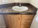 Corner sink vanity with wood cabinets and drawers at 1398 S Cheyenne Dr, Apache Junction, AZ 85119