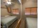 Bedroom with mirrored closet and two twin-size beds at 1398 S Cheyenne Dr, Apache Junction, AZ 85119