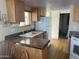 Simple kitchen with light cabinets and white appliances at 1398 S Cheyenne Dr, Apache Junction, AZ 85119