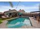 Stunning backyard with a sparkling pool and grassy area at 2106 E Williams Dr, Phoenix, AZ 85024