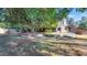 Landscaped backyard with mature trees and patio at 2181 E La Vieve Ln, Tempe, AZ 85284