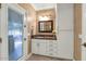 Clean bathroom with granite vanity and exterior access at 2181 E La Vieve Ln, Tempe, AZ 85284