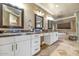 Elegant bathroom with double vanity, granite countertops, and soaking tub at 2181 E La Vieve Ln, Tempe, AZ 85284