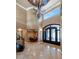 Grand entry with a curved staircase and a large chandelier at 2181 E La Vieve Ln, Tempe, AZ 85284