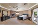 Main bedroom with fireplace, large windows, and access to a private balcony at 2181 E La Vieve Ln, Tempe, AZ 85284