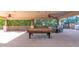 Large covered patio with pool table and seating area at 2181 E La Vieve Ln, Tempe, AZ 85284