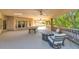 Covered patio with pool table, seating area, and scenic backyard views at 2181 E La Vieve Ln, Tempe, AZ 85284