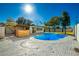 Relaxing kidney-shaped pool in sunny backyard at 2202 W Berridge Ln, Phoenix, AZ 85015