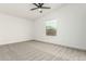 Spacious bedroom with large window and ceiling fan at 28904 N Varnum Rd, San Tan Valley, AZ 85143