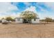 White single-story home with ramp access and mature tree at 28904 N Varnum Rd, San Tan Valley, AZ 85143