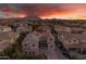 Aerial view of house with solar panels and pool, beautiful sunset in background at 3121 E Powell Way, Gilbert, AZ 85298