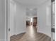 Bright hallway with wood flooring leading to bedrooms at 3121 E Powell Way, Gilbert, AZ 85298