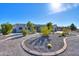 Landscaped front yard with gravel, desert plants, and a curved walkway at 31315 N 155Th St, Scottsdale, AZ 85262