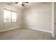 Simple bedroom with neutral carpeting and a large window at 3717 E Appaloosa Rd, Gilbert, AZ 85296