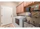 Laundry room with washer, dryer, and ample storage at 39213 N 25Th Ave, Phoenix, AZ 85086