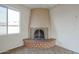 Brick fireplace with metal screen in living room at 4901 W Augusta Cir, Glendale, AZ 85308