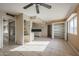 Living room with tile floors, ceiling fan, and access to kitchen at 4901 W Augusta Cir, Glendale, AZ 85308