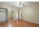 Bright bedroom with mirrored closet doors and wood floors at 524 S Allred Dr, Tempe, AZ 85288