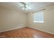 Spacious bedroom with hardwood floors and a ceiling fan at 524 S Allred Dr, Tempe, AZ 85288